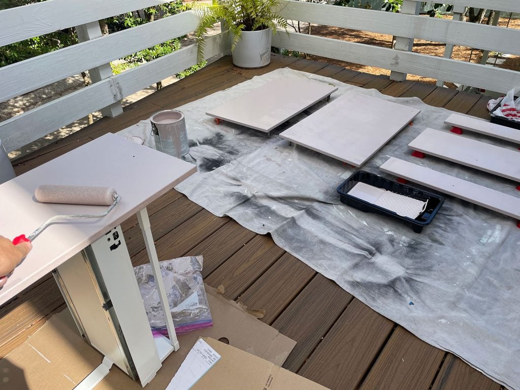 painting-ikea-cabinets-second-coat-on-fronts-1024x768-1 Ikea Cabinet Doors Laid Out On Deck While Being Painted