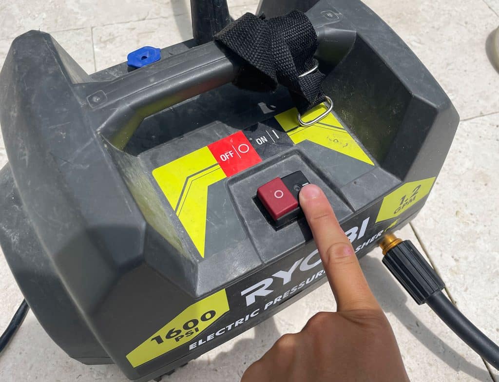 pressure-washing-101-power-button-on-1024x784-1 Pressing power button on Ryobi electric pressure washer
