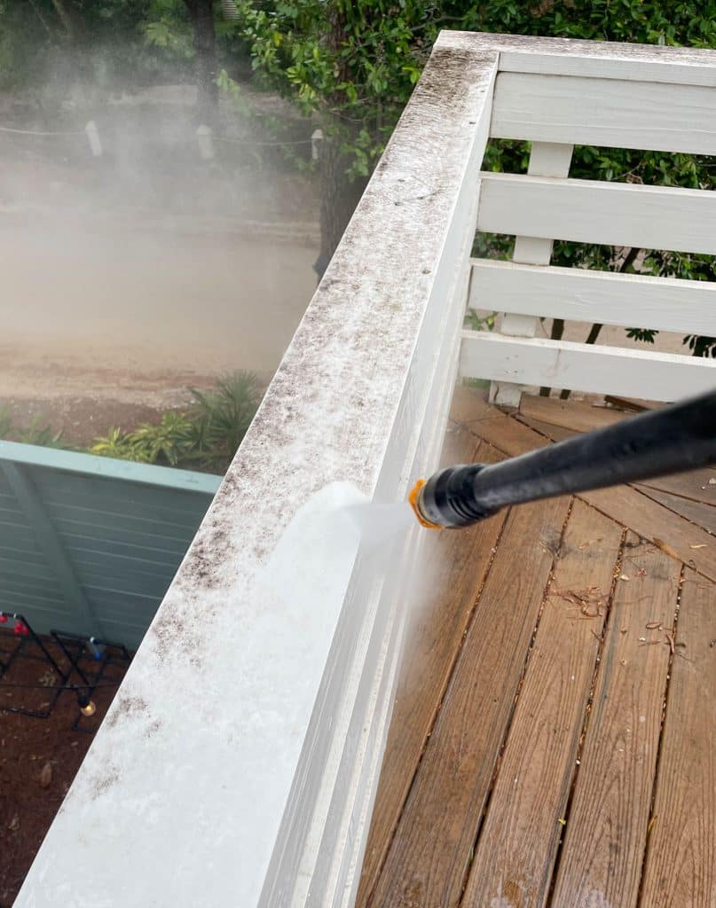 pressure-washing-101-spraying-railings-807x1024-1 Pressure Washing White Painted Railings On Deck