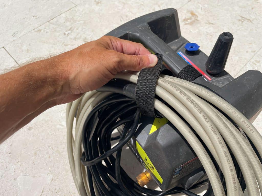 pressure-washing-101-wrap-cords-1024x768-1 Securing cords on Ryobi electric pressure washer with built in velcro strap
