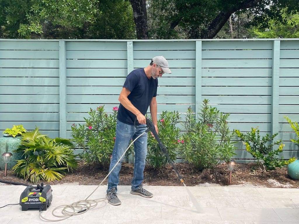 pressure-washing-guide-john-spraying-pool-deck-1024x768-1 John pressure washing pool deck patio with Ryobi electric power washer