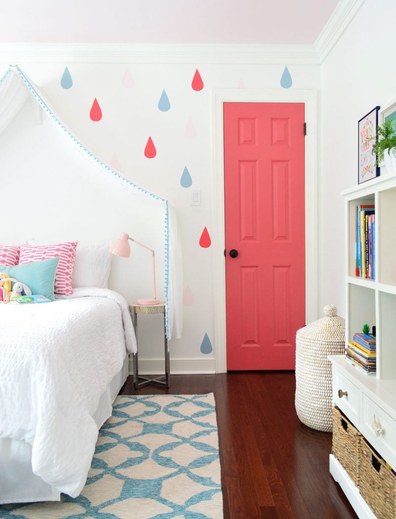 simply-white-girls-bedroom-with-pink-door-782x1024-1 Colorful Little Girls Bedroom With Raindrop And Pink Door On Simply White Walls