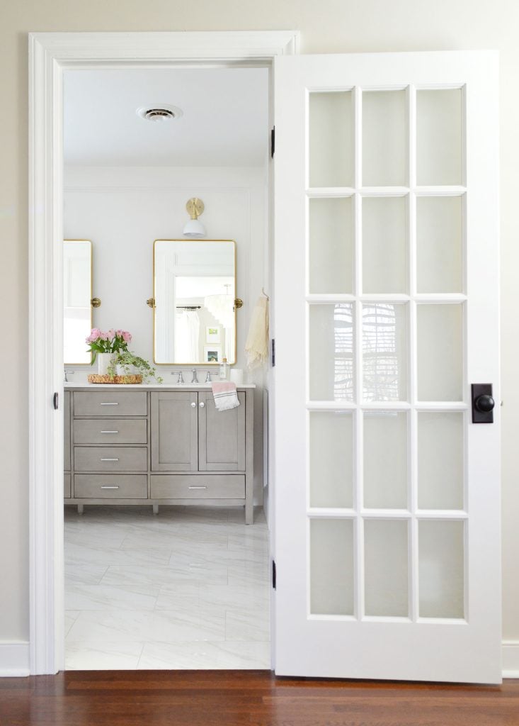 simply-white-trim-and-french-door-to-bathroom-733x1024-1 White Painted Glass Paned Door To Marble Bathroom