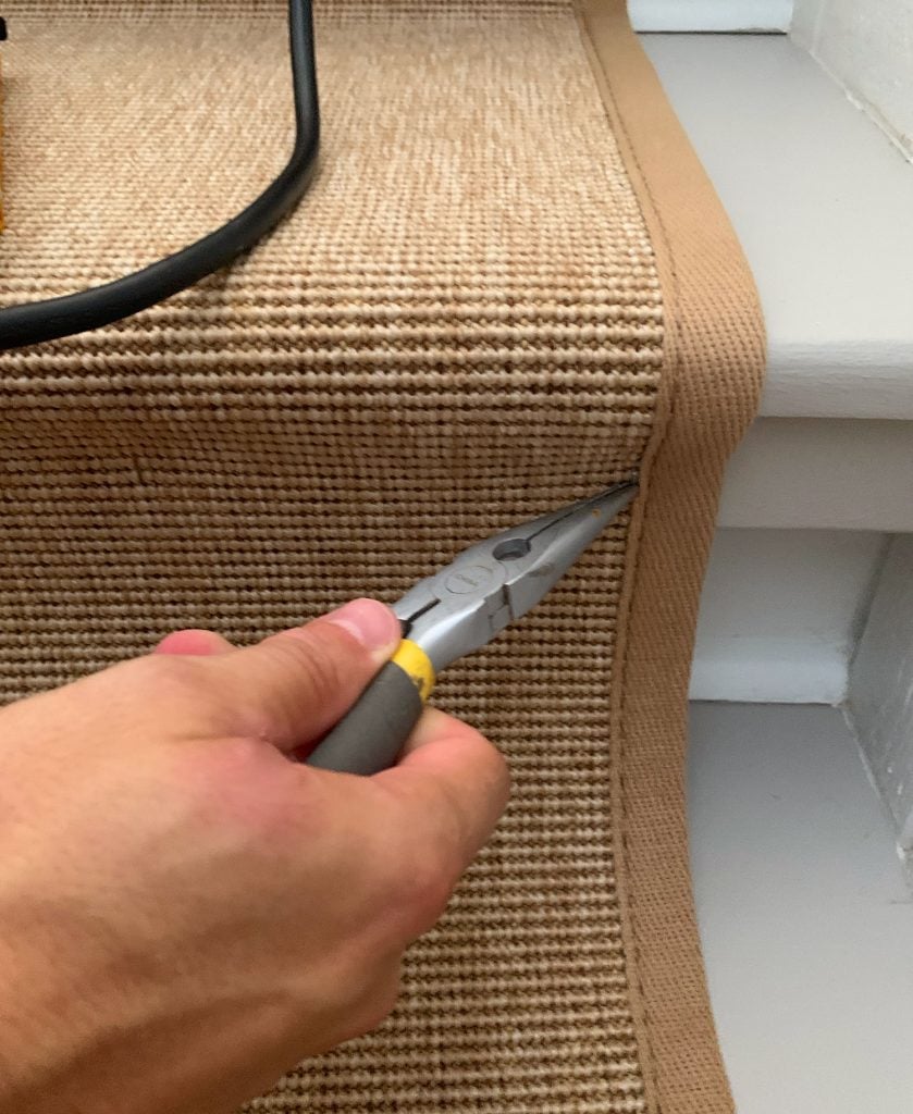 sisal-stair-runner-prying-up-staple-839x1024-1 Needlenose Pliers Removing Staple On Sisal Stair Runner