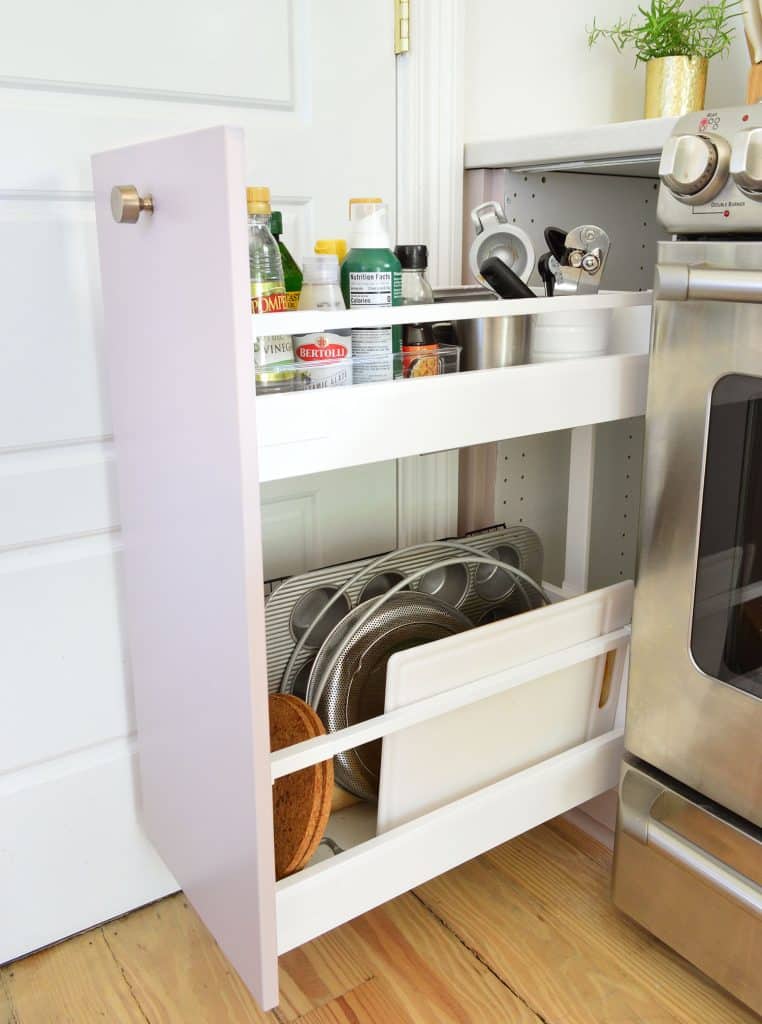 small-kitchen-org-oil-drawer-762x1024-1 Narrow Drawer Next To Stove With Oils And Cutting Boards