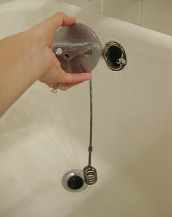 unclogging-a-drain-overflow removing overflow cover in clogged bathroom drain