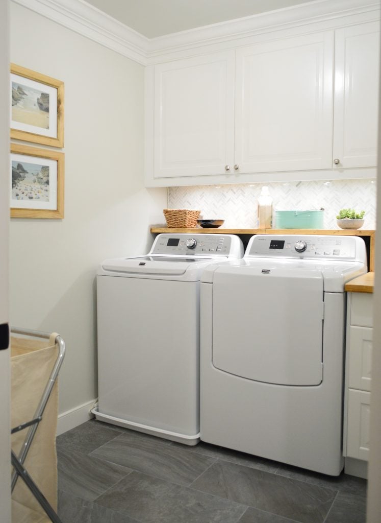 under-cabinet-lights-11-lights-on-747x1024-1 White Laundry Room With Marble Tile Backsplash
