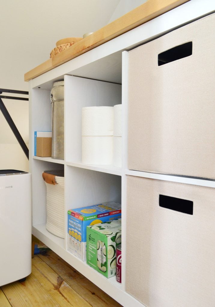 utility-closet-cubby-drink-storage-716x1024-2 Cubby Storage Shelf In Utility Closet With Butcher Block Counter