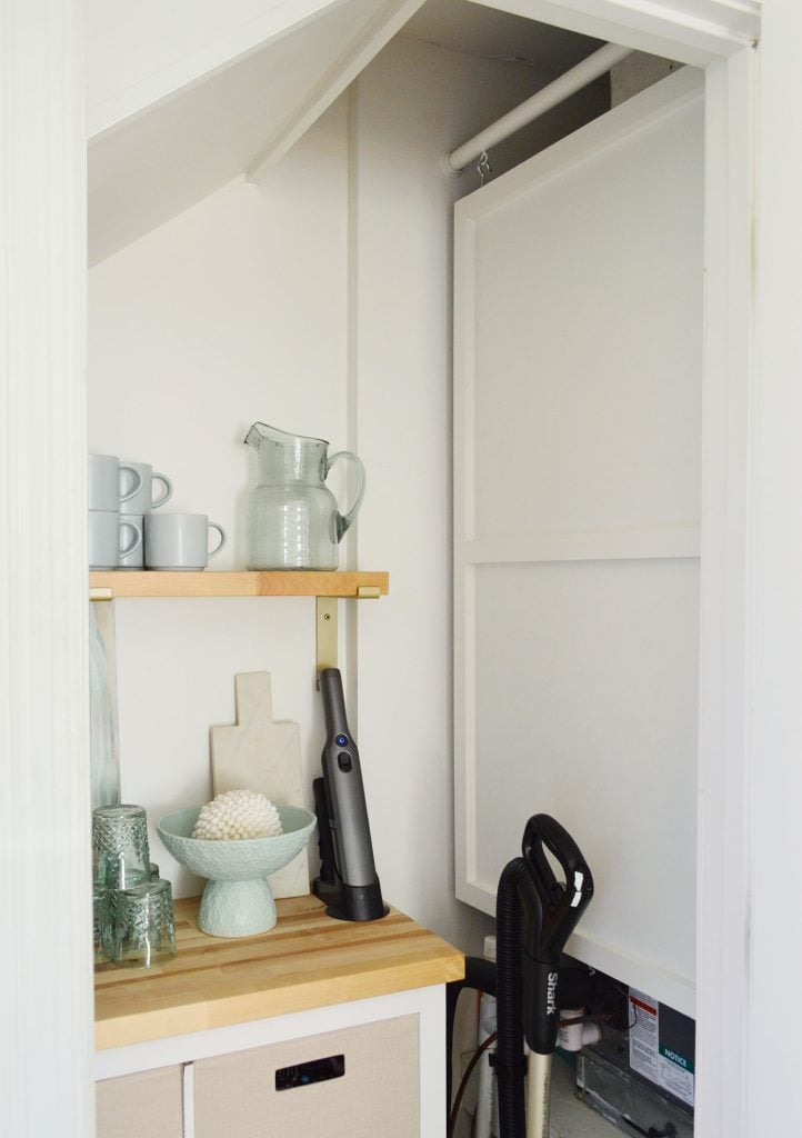 utility-closet-hvac-hidden-panel-722x1024-1 Wood Cover Panel Hanging In Utility Closet To Hide HVAC Unit