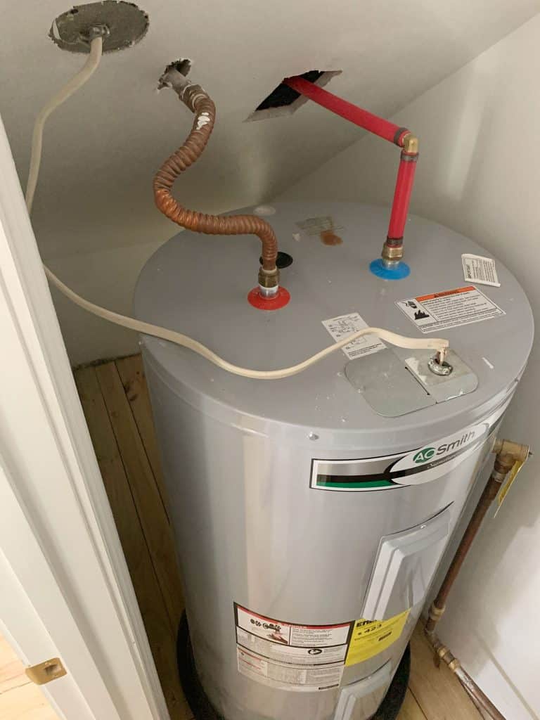 utility-closet-water-heater-before-768x1024-1 Before Photo Of Large Electric Water Heater Tank In Utility Closet