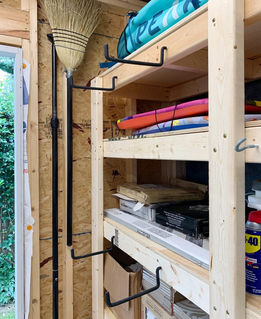 beach-shed-organization-big-hooks-on-shelf-838x1024-1 Large rubber hanging hooks on front of heavy duty shed shelves