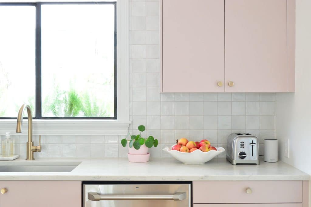 beachy-kitchen-tile-backspash-fruit-bowl-1024x681-1 Closer View Of Square Tile Backsplash With Mauve Pink Painted Cabinets