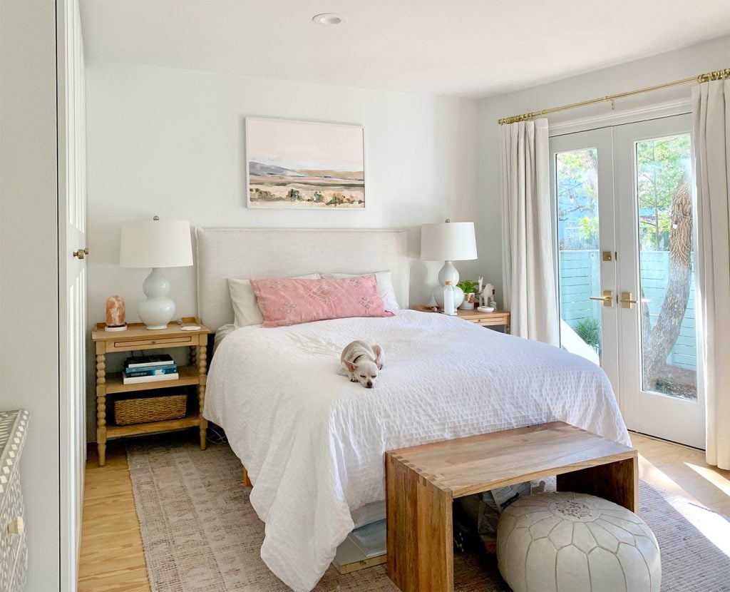 bedroom-bed-wall-no-doors-1024x830-1 Bedroom with pink rug with french doors next to white bed
