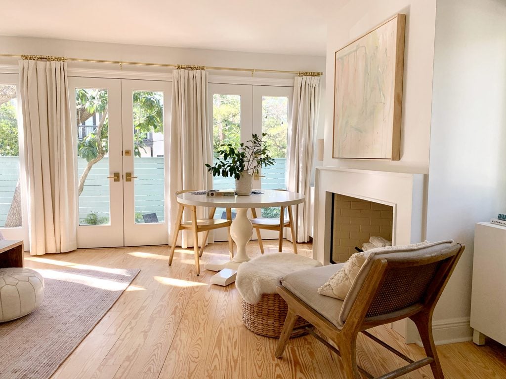 bedroom-towards-doors-and-fireplace-1024x768-1 Side view of fireplace seating area with view into fenced side yard