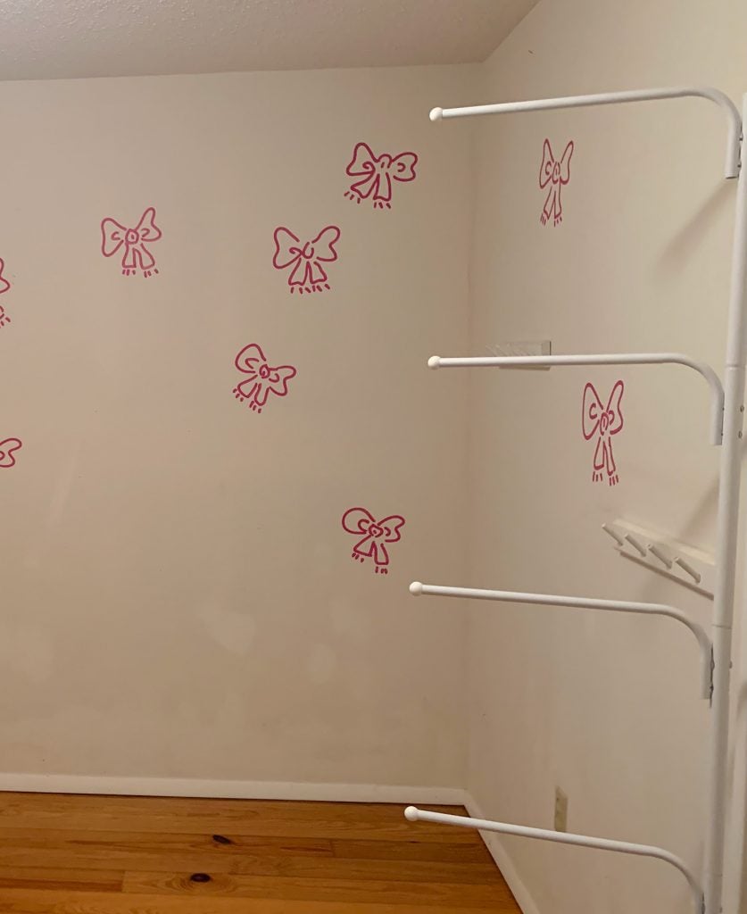 before-shot-of-colorful-slat-wall-837x1024-1 Before photo of Boys Bedroom With Painted Bow Mural On White Walls