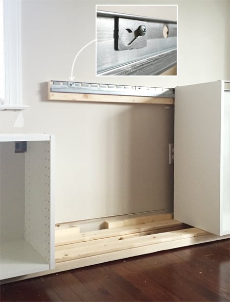 bonusbuilts-lowers-newrailsystem detail of how Ikea Sektion cabinets attach to metal wall rail using screw and washer