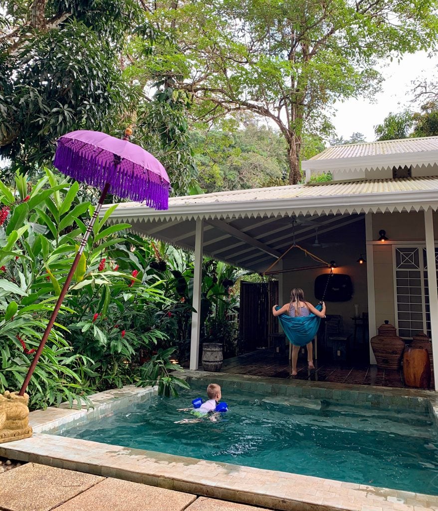 costa-rica-vacation-balinese-airbnb-kids-in-swing-878x1024-1 Kids Playing At Tropical Airbnb In Costa Rica With Pool And Swing