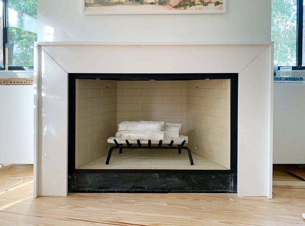 diy-fireplace-mantel-outer-trim-added-1024x760-1 Mantel With White Trim Pieces Added Around Outside To Add Depth