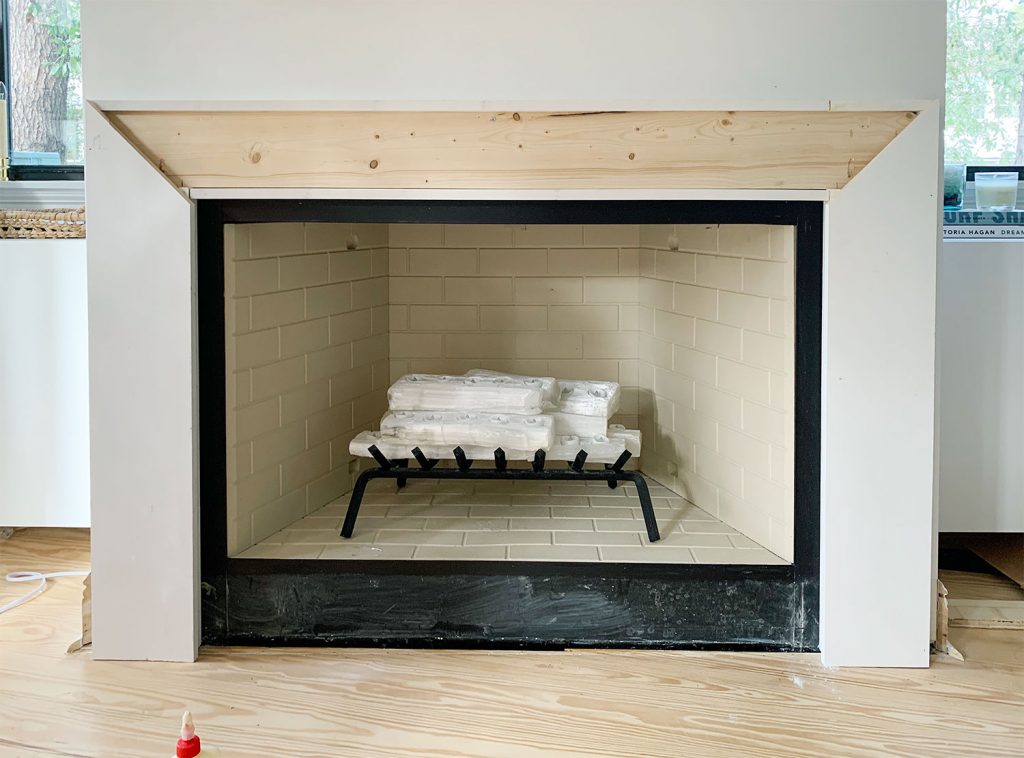 diy-fireplace-mantel-side-flat-piece-added-1024x758-1 Thick White Boards Added To Both Sides Of Brace Piece With Angled Miter Cuts At Top