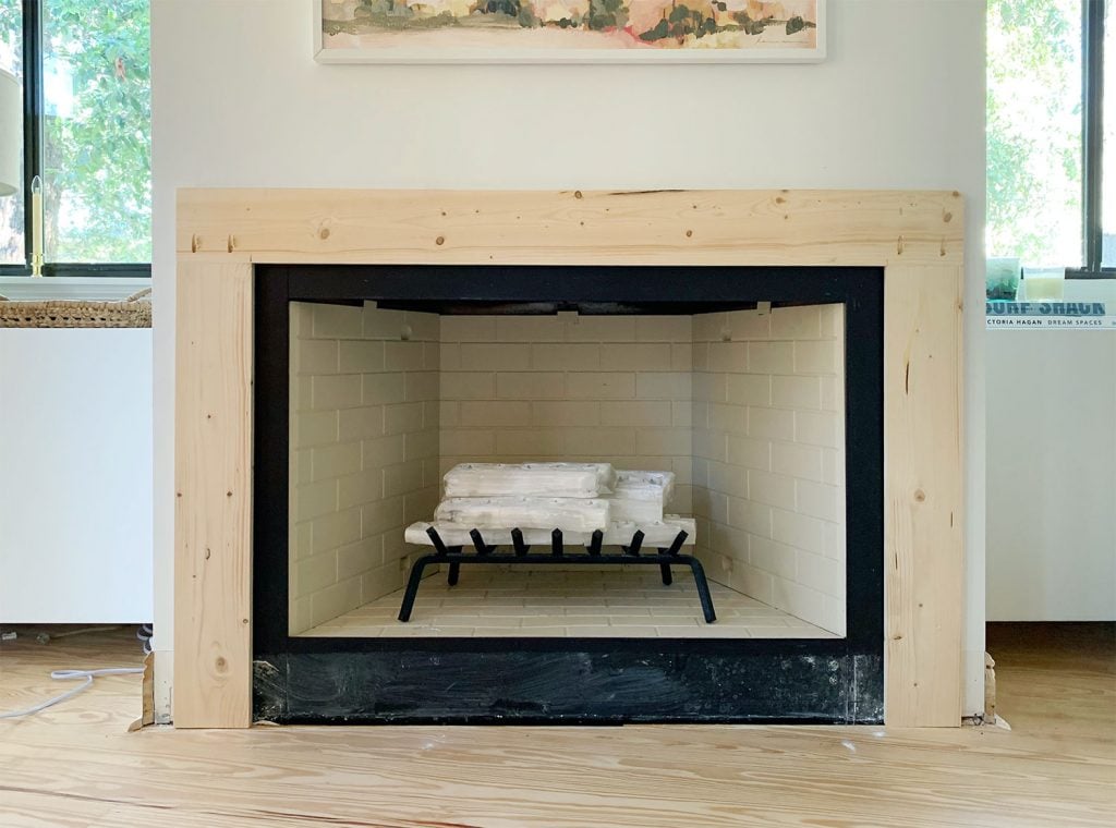 diy-fireplace-mantel-wood-brace-added-1024x760-1 Mantel Brace Piece Made Of Raw Wood Surrounding Fireplace On 3 Sides