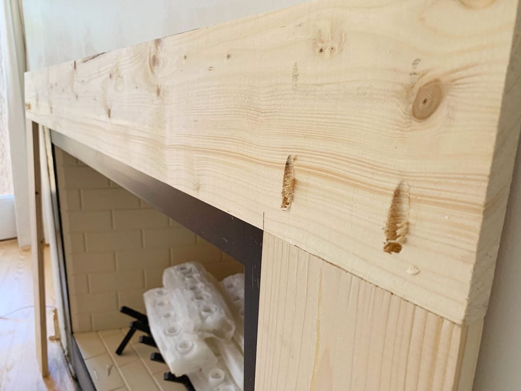 diy-fireplace-mantel-wood-brace-close-up-1024x768-1 Close Up Of Wood Brace Piece With Pocket Holes To Secure It Together