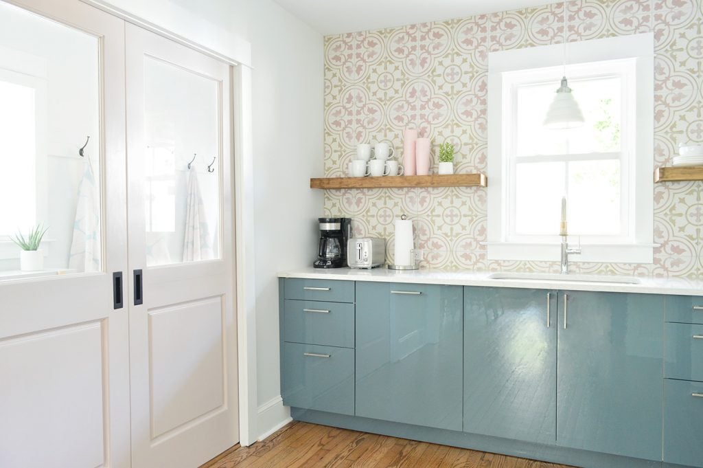 duplex-kitchen-pink-with-mudroom-doors-closed-1024x681-1 Floating Kitchen Shelves In Colorful Kitchen With Pink Tile And Blue Cabinets