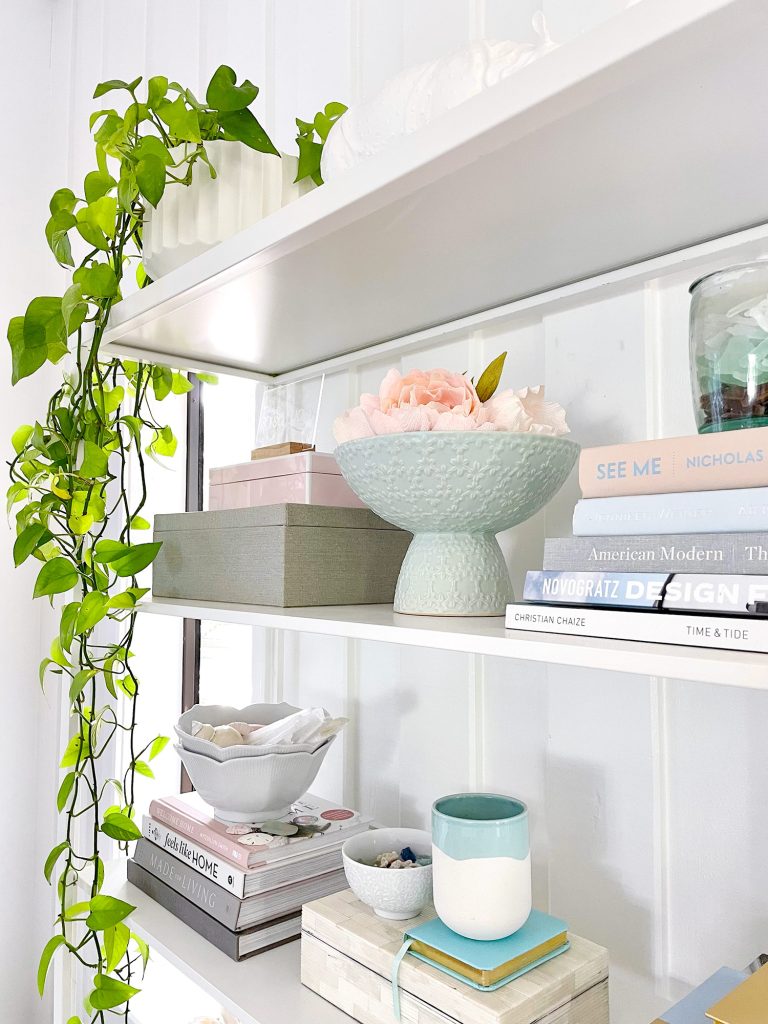 family-room-plant-on-corner-of-shelf-768x1024-1 Side View Of Styled Shelves Of Ikea Fjalkinge Bookcase With Stacked Books And Plants