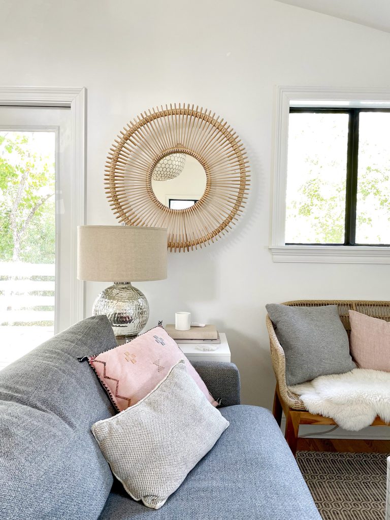 family-room-sofa-mirror-detail-vertical-768x1024-1 Round Woven Mirror Behind Side Table Next to Family Room Couch