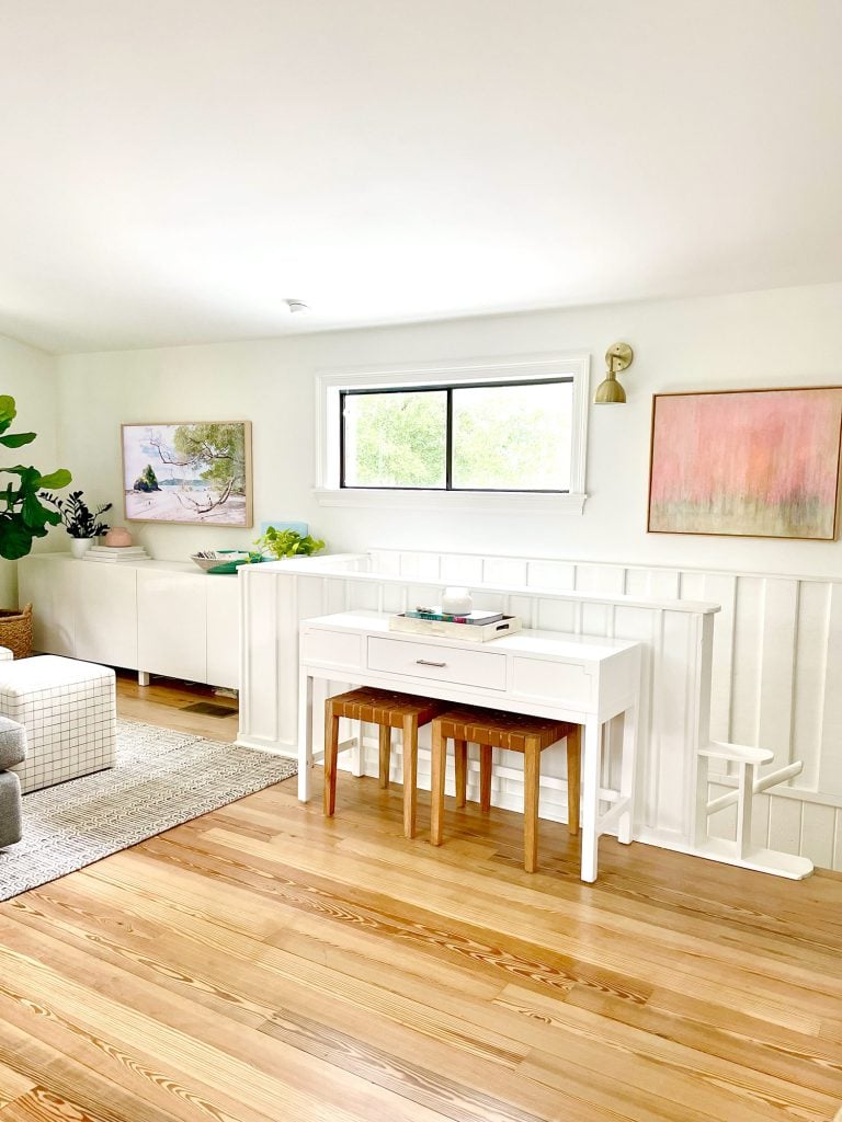 family-room-tv-wide-wall-shot-768x1024-1 Console Table By Stairs In Upstairs Modern Family Room With White Paneled Wainscoting