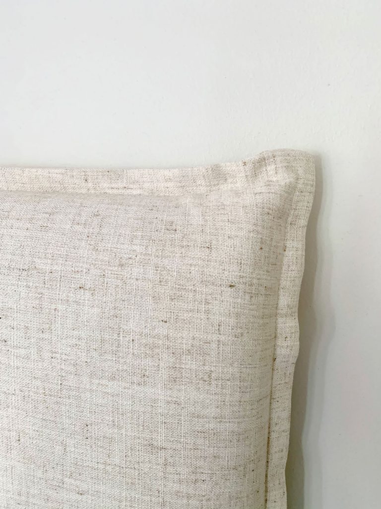 fireplace-corner-of-headboard-768x1024-1 Close up detail of french seam on edge of linen headboard
