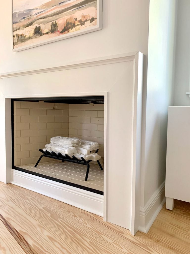 fireplace-done-corner-detail-768x1024-1 Closer view of fireplace surround showing about an inch of drywall between it and corner of wall