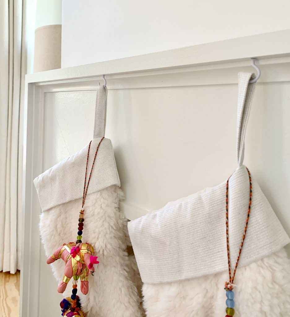 fireplace-stocking-hooks-detail-937x1024-1 Close up detail of stockings hanging from mantel using small white cup hooks
