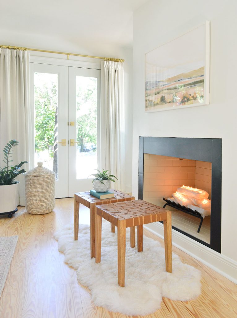 florida-bedroom-fireplace-angle-lit-766x1024-1 Bedroom fireplace with white crystal logs stacked like firewood and candles lit
