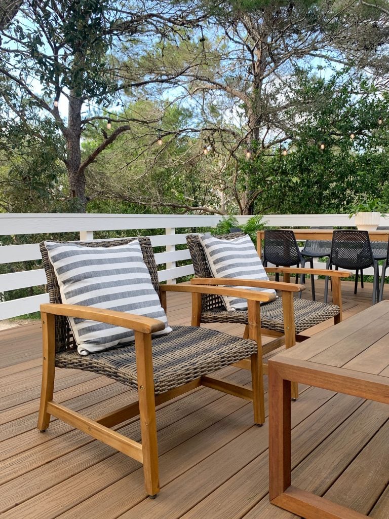 florida-deck-lounge-chairs-angle-vertical-768x1024-1 Two Woven And Wood Outdoor Lounge Chairs With Large Striped Pillows