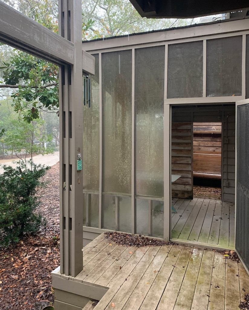 florida-house-exterior-before-screened-porch-to-street-1-824x1024-1 Before photo of same angle with brown railings and siding and gross screening