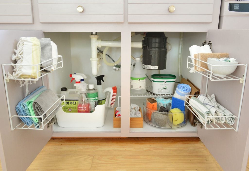 florida-kitchen-organization-under-sink-1024x704-1 Under sink cleaning supply storage in kitchen with mauve cabinets