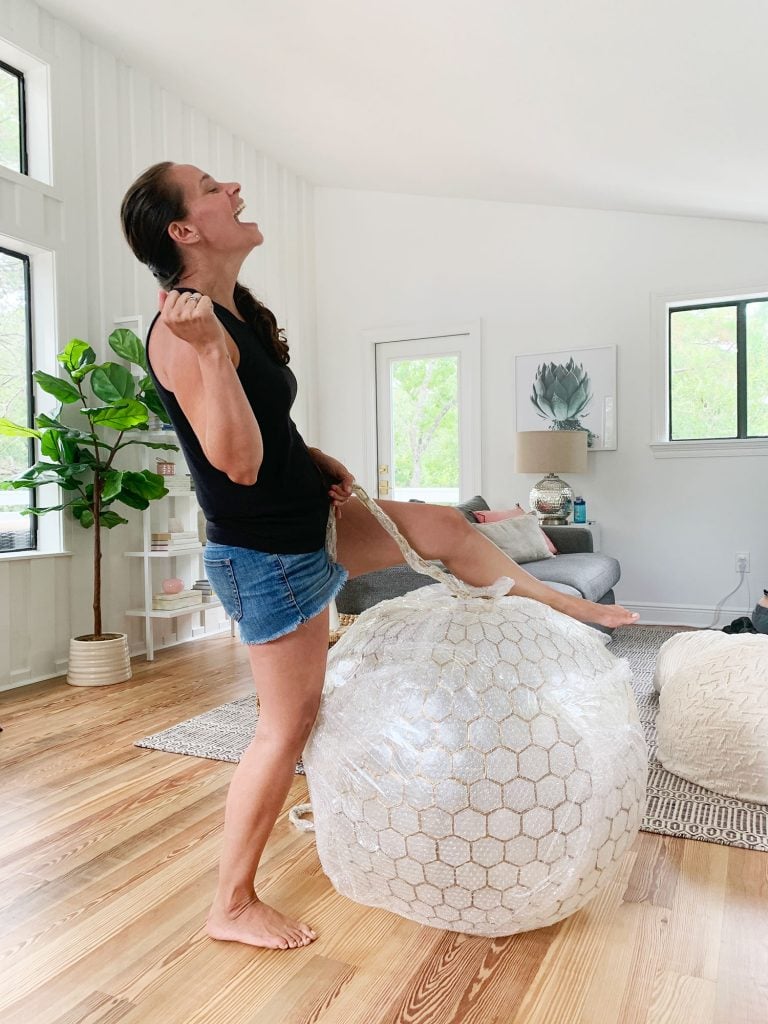 florida-living-room-sherry-wrecking-ball-768x1024-1 Sherry Pretending To Reenact Miley Cyrus Wrecking Ball On Large Capiz Globe Light