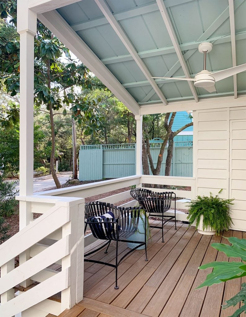 front-porch-fall-covered-porch-793x1024-2 Blue Ceiling On Covered Porch With Ceiling Fan And Black Chairs
