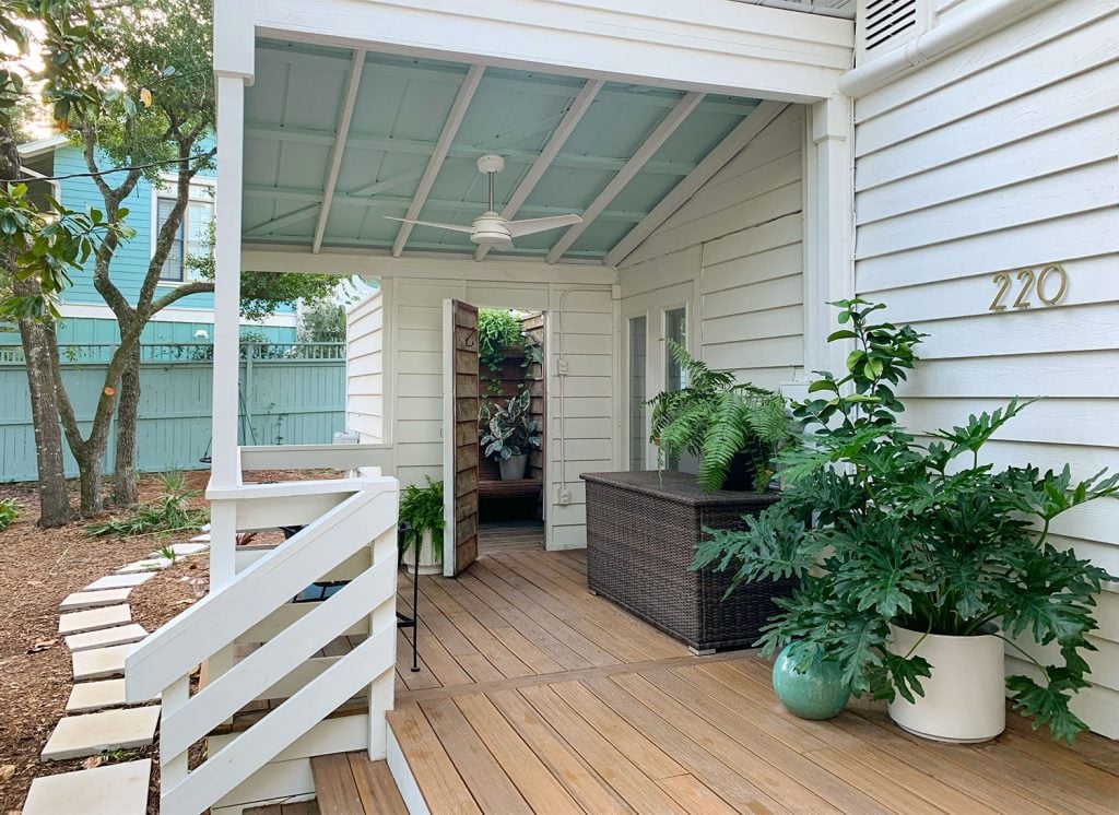 front-porch-fall-covered-porch-from-steps-1024x746-1 Covered Porch Area With Tropical Plantings Storage Bin And Outdoor Shower
