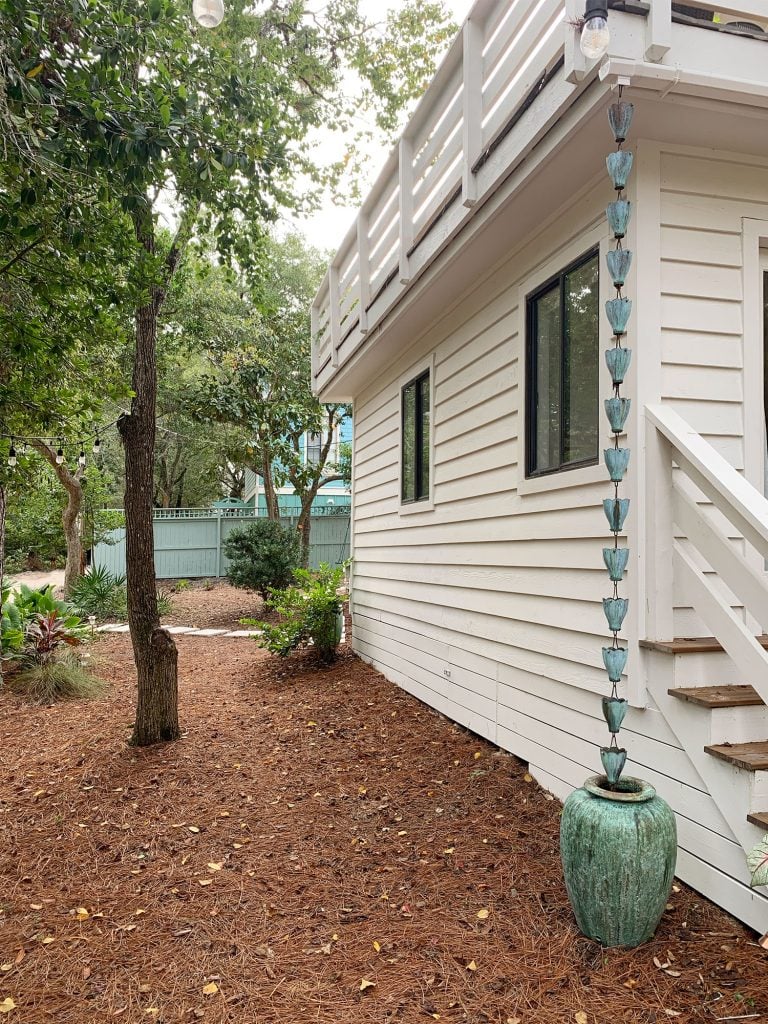 front-porch-fall-rain-chain-768x1024-1 Copper Patina Rain Chain On Corner Of House Into Green Pot