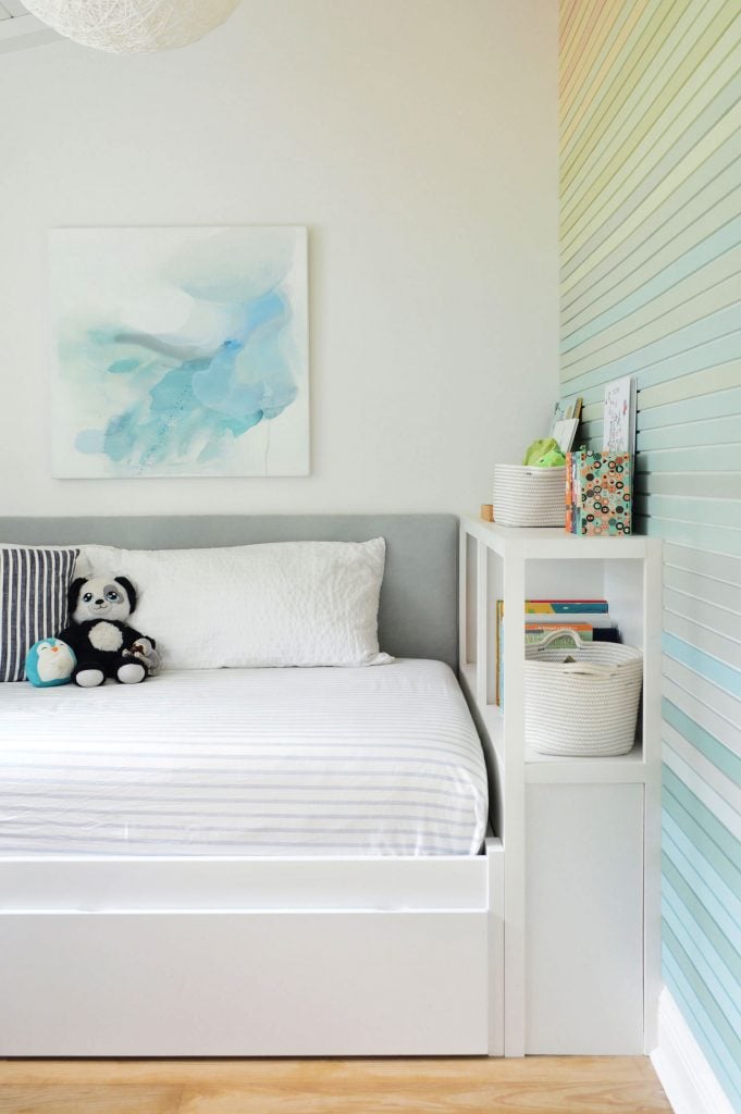 gradient-stripe-wall-straight-from-door-681x1024-1 Boys Twin Bed With Fabric Headboard Bookcase And Rainbow Gradient Wall Treatment