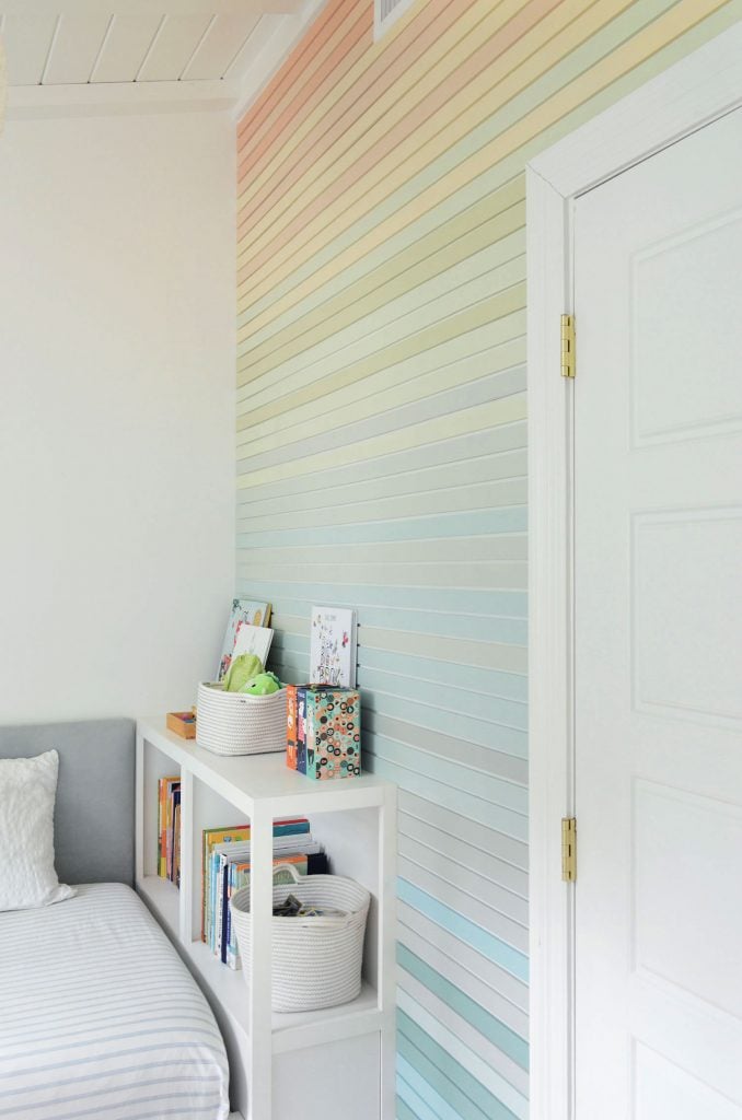 gradient-stripe-wall-straight-from-door-angle-678x1024-1 Angled View Of Rainbow Gradient Wood Panel Treatment Going From Orange To Blue