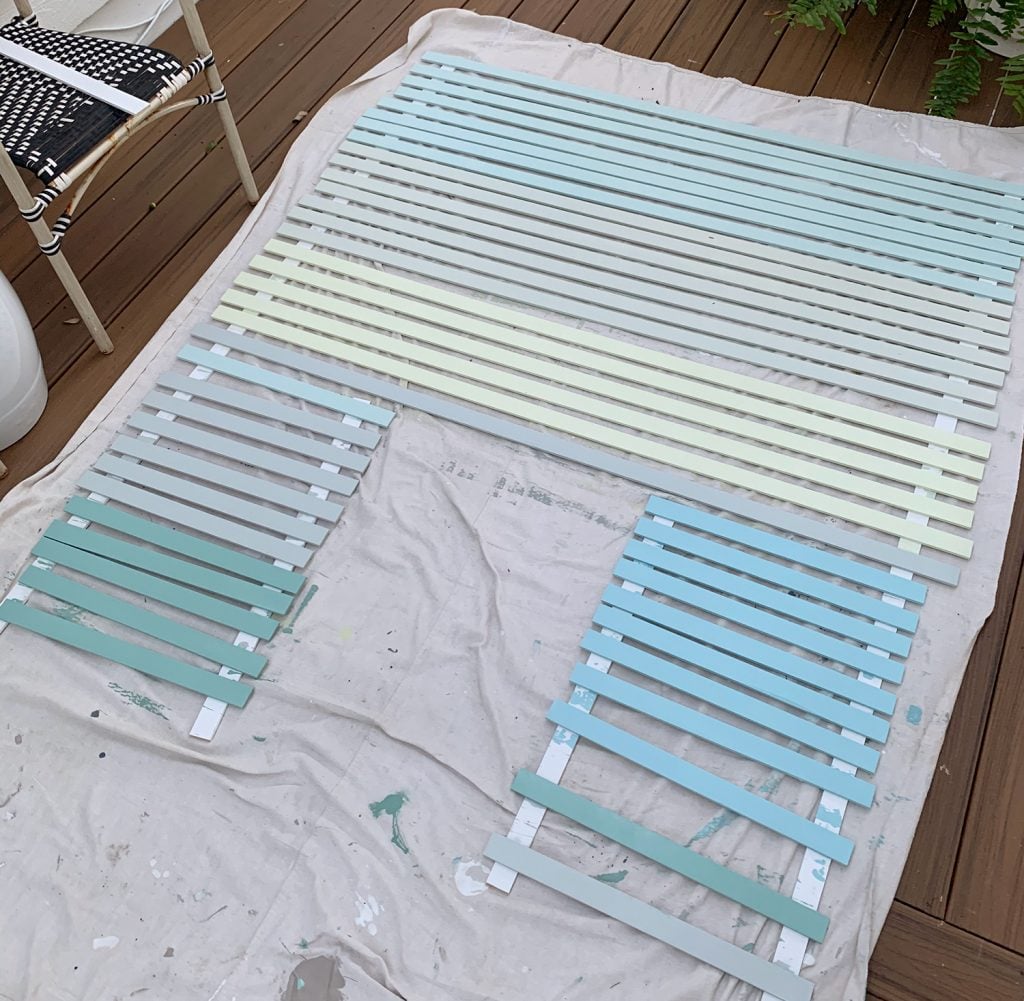 gradient-wall-blue-gray-painted-strips-1024x1001-1 Painted Lattice Strips Laid Out On Deck In Various Blue Green And Gray Colors