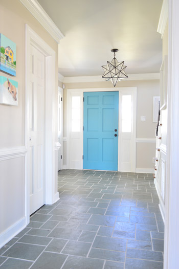 grout10 slate tile floor foyer with clean white grout and colorful blue door