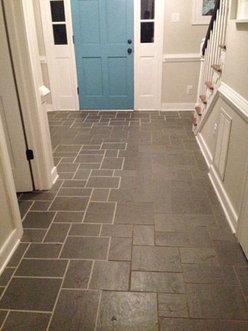 grout7 side by side comparison of clean bright grout and dirty discolored grout from using grout paint in foyer