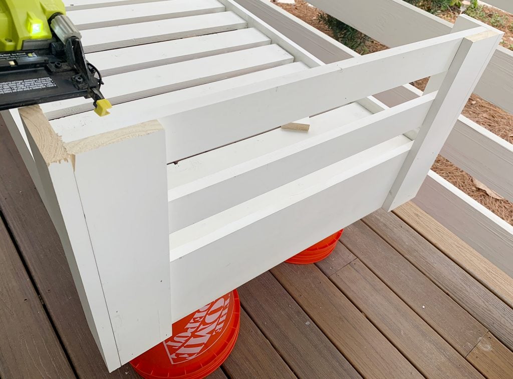 hanging-daybed-nailing-top-rail-1024x758-1 Attaching upper horizontal rail connected two corner pieces