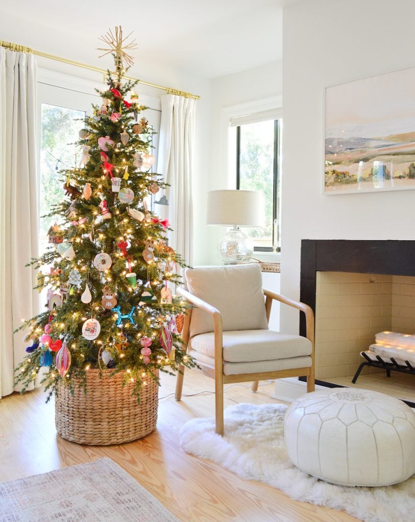 holiday-decor-2020-christmas-tree-in-basket-814x1024-1 Christmas Tree in Woven Basket Near Fireplace