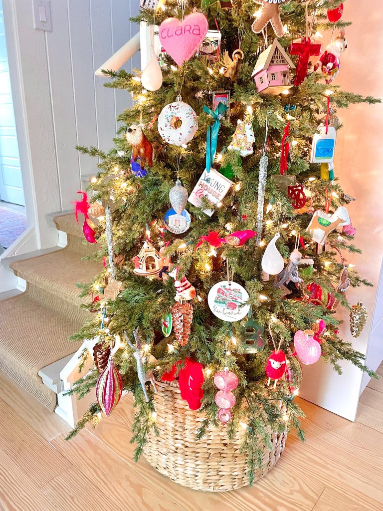 holiday-house-closer-shot-of-tree-768x1024-1 Detail of ornaments on narrow Christmas tree in kitchen in wicker basket