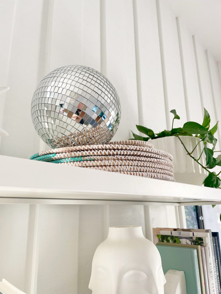 holiday-house-disco-ball-768x1024-1 Decorative disco ball on top of shelves in office