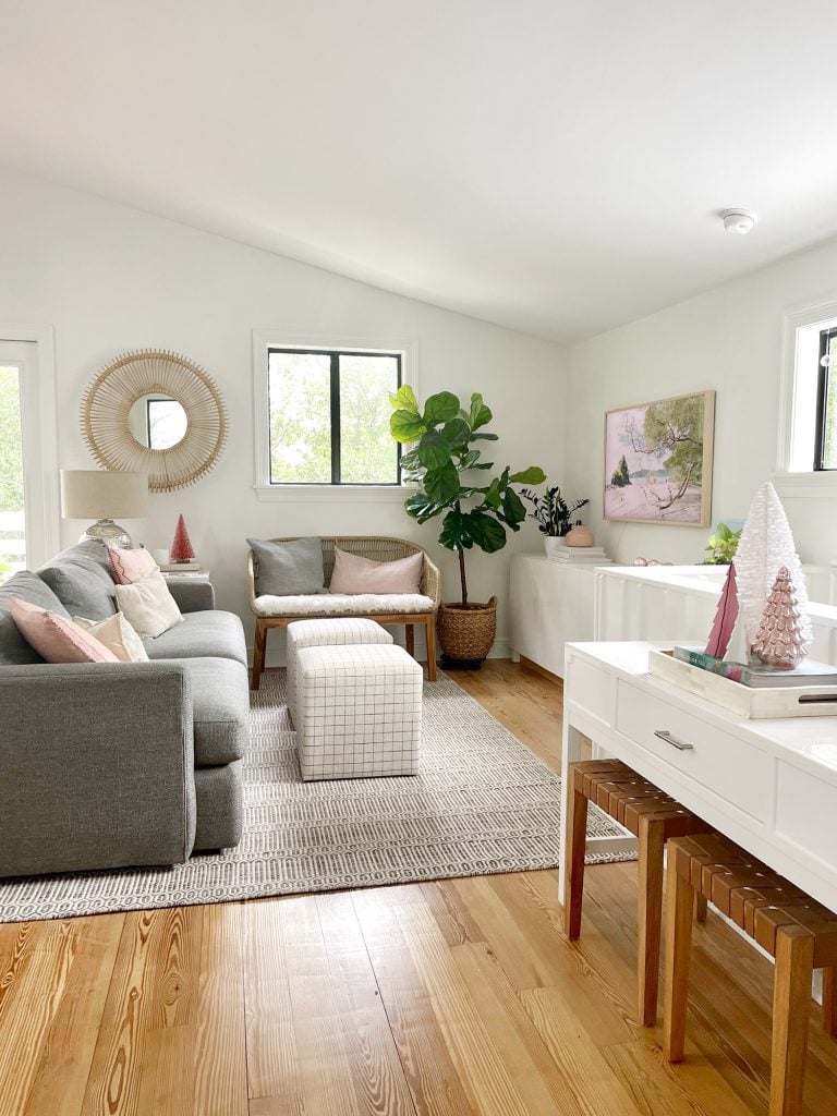 holiday-house-family-room-tv-area-wide-768x1024-1 Angled view of living room with new sheepskin loveseat and decorative Christmas trees on tabletop